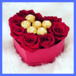 Chocolate and roses in heart box