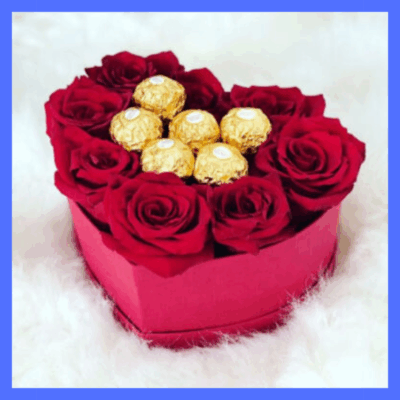 Chocolate and roses in heart box