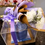 Luxury Acrylic Box Cake with customized cake and fresh imported flower bouquet for gift delivery in Karachi.
