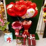 Grand Birthday Celebration Hamper with money bouquet, imported roses, Layers chocolate cake, chocolates, balloons, muffins, and luxury birthday decorations.