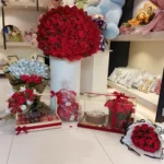 Grand Royal Celebration Hamper with cash bouquet, 250 red roses, Layers chocolate cake, teddy bear, luxury chocolates, and premium flower arrangements.