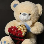 Royal Teddy & Ferrero Rose Box with 3 Feet Teddy Bear, fresh red roses, Ferrero Rocher chocolates, and heart-shaped gift box.